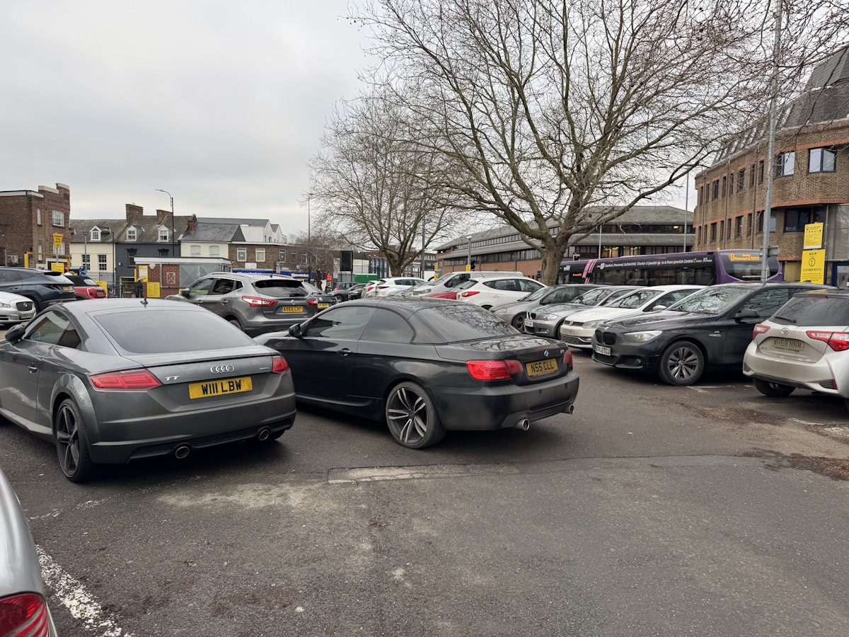 A badly parked black BMW at Tower Ramparts car park in Ipswich